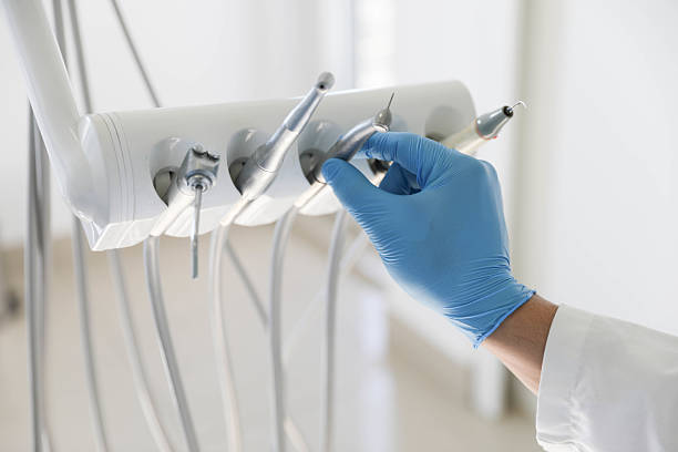 Professional Tooth Extraction technician working in Roland, IA